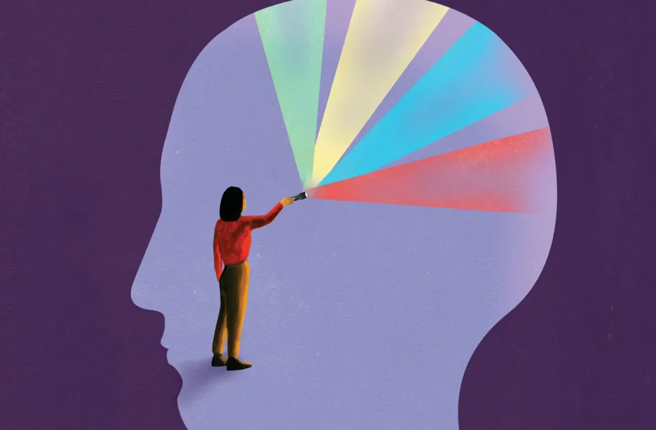 Illustration of a person inside an outline of a head, shining multi-colored light in all directions