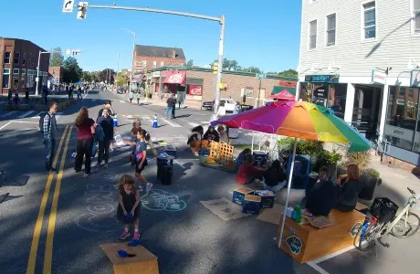 A ParKit set up in the street, a scene filled with people and games
